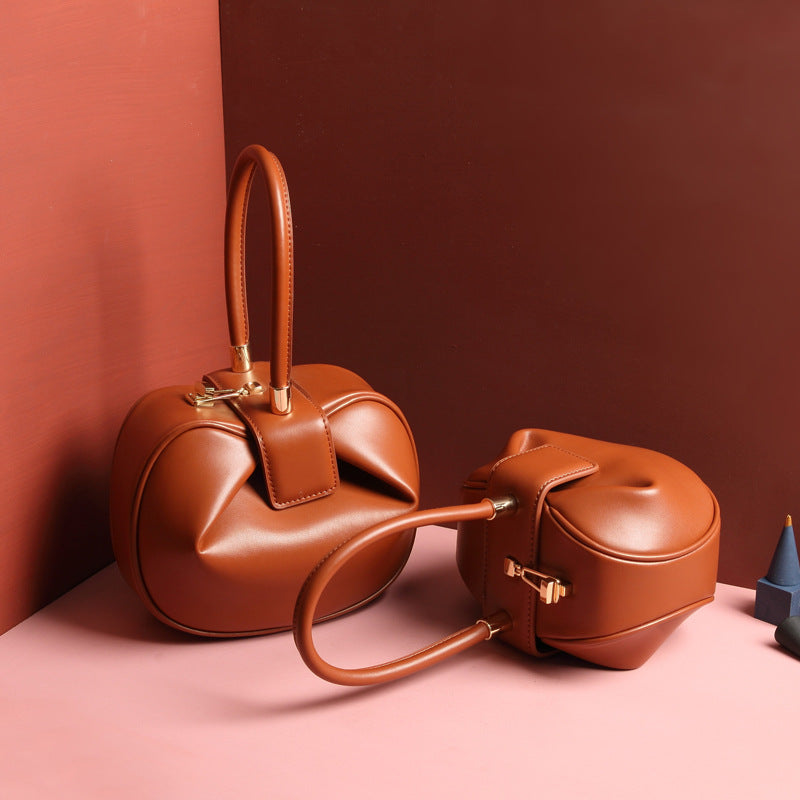 Luxury leather ladies handbag by Shamew featuring a unique dumpling design, stylish and high-quality fashion accessory.