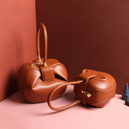 Luxury leather ladies handbag by Shamew featuring a unique dumpling design, stylish and high-quality fashion accessory.