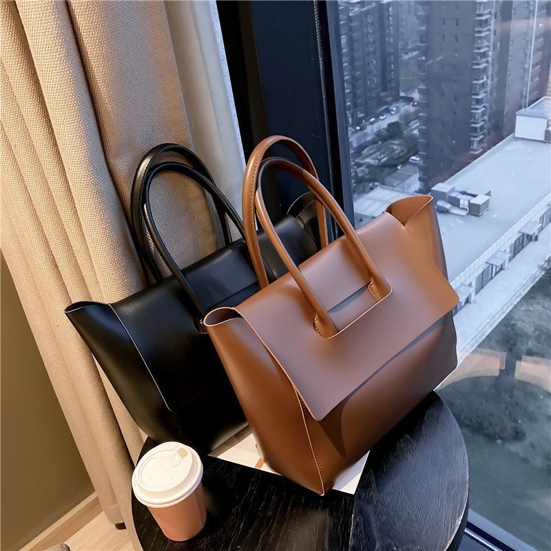 Large capacity simple retro tote bag for ladies, luxury handbag by Shamew with minimalist design and sturdy handles.